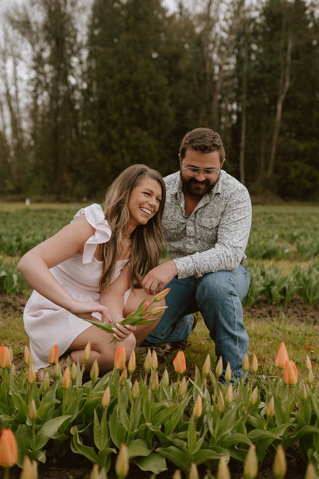 Couple in a field of tulips at Tulip Valley Farms during Tulip Festival