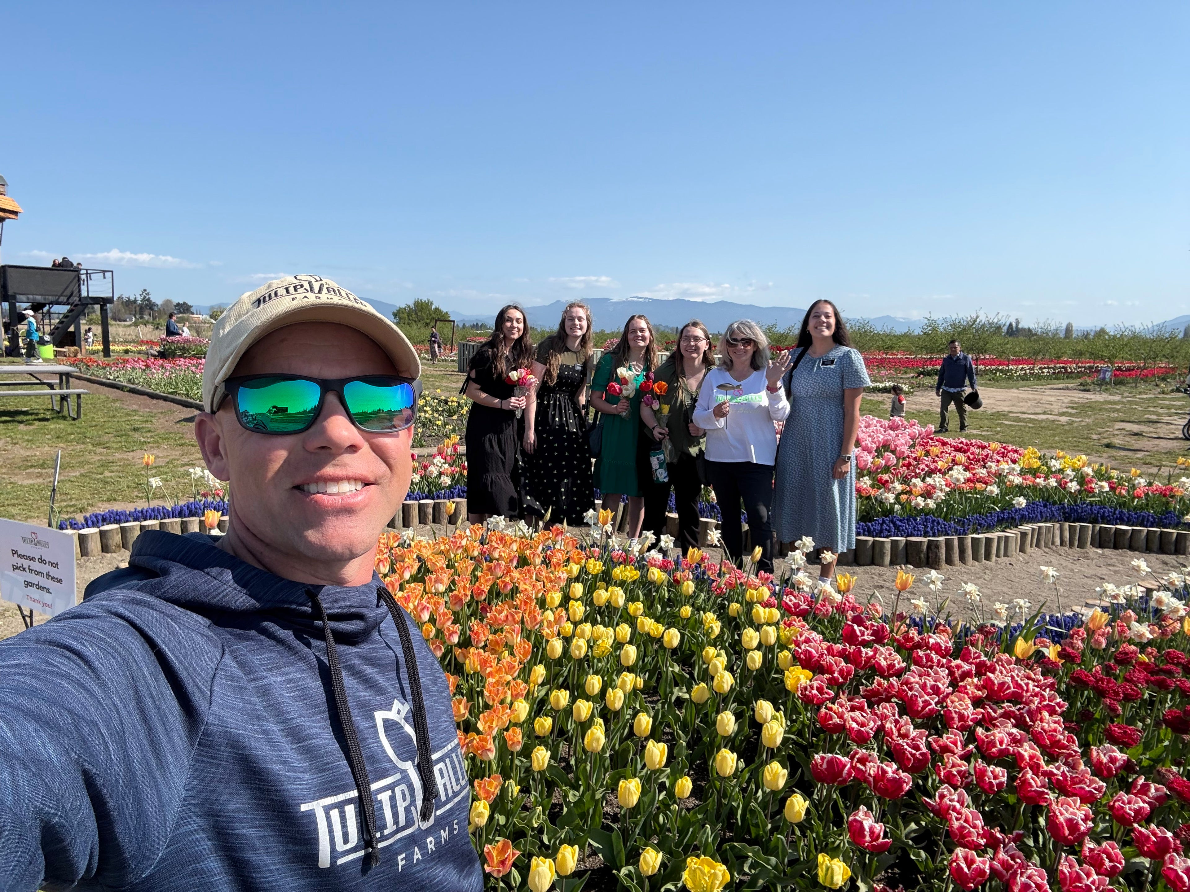 Tulip Valley Farms CEO Andrew Miller with a group of Tulip Festival visitors
