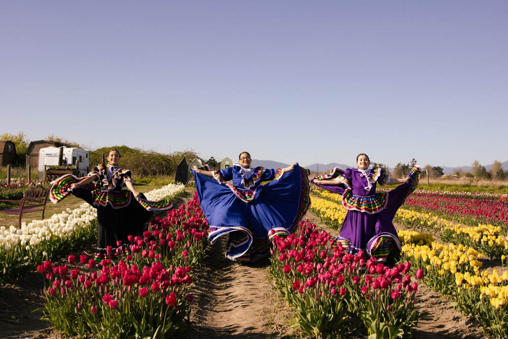 Latina dancers in the tulip fields at Tulip Valley Farms