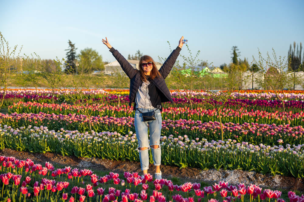 Woman standing in the tulip fields at Tulip Valley Farms